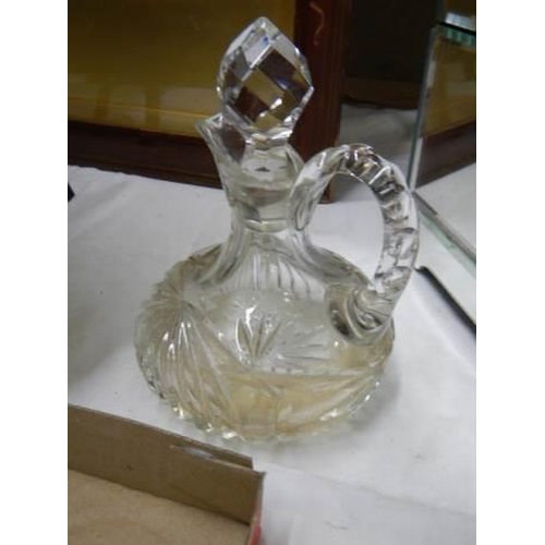 787 - A cut glass milk jug, sugar bowl, oil bottle etc.,