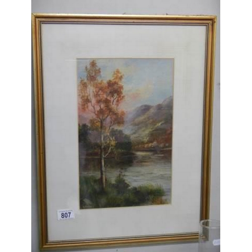 807 - A gilt framed and glazed mountain lake scene signed L Eccles?, 40 x 53 cm, COLLECT ONLY.