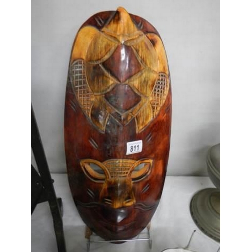 811 - A carved wood tribal mask.