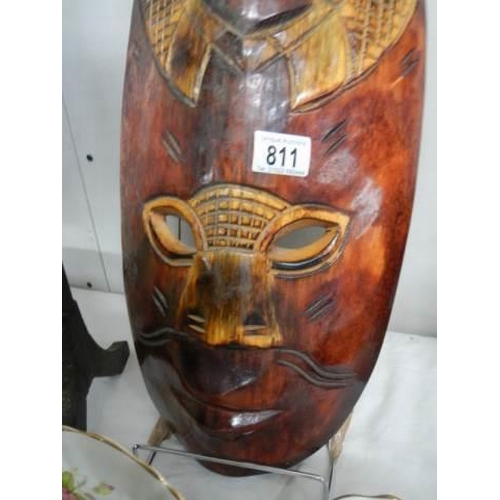 811 - A carved wood tribal mask.