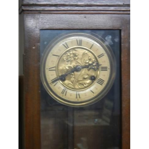 812 - An Edwardian mahogany wall clock with art nouveau brass dial. COLLECT ONLY.