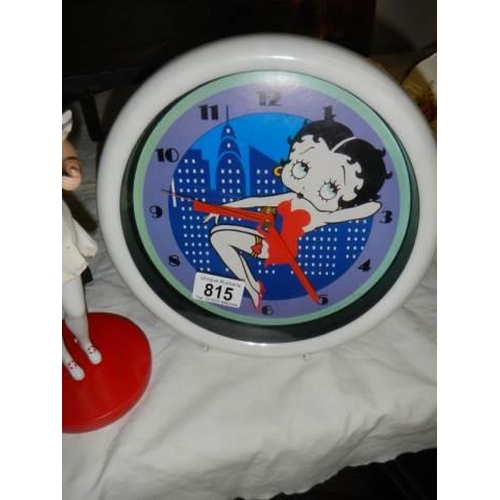 815 - A Betty Boop nurse figure on a base approx. 35cm, (1 finger a/f) and a Betty Boop wall clock.