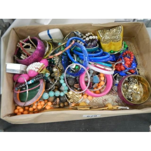 829 - A good lot of bracelets and other costume jewellery.