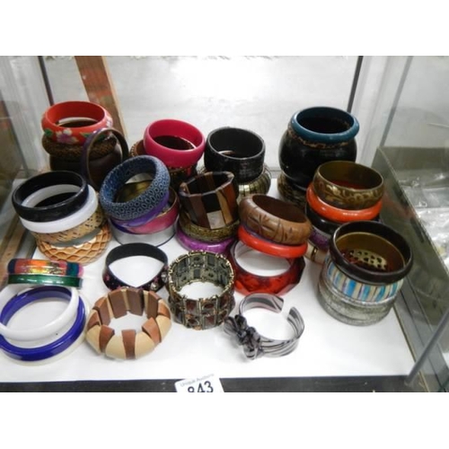 843 - Approximately fifty fashion bangles.