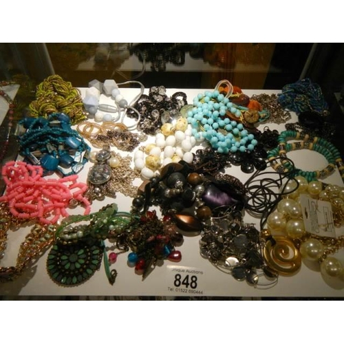 848 - A mixed lot of necklaces etc.,