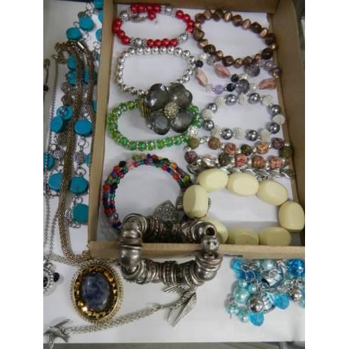 853 - Approximately 20 bracelets and 6 necklaces.