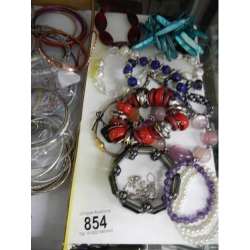 854 - A good lot of bracelets and bangles.