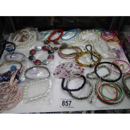 857 - A good lot of bracelets etc.,