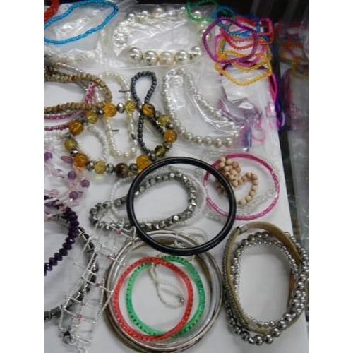 857 - A good lot of bracelets etc.,