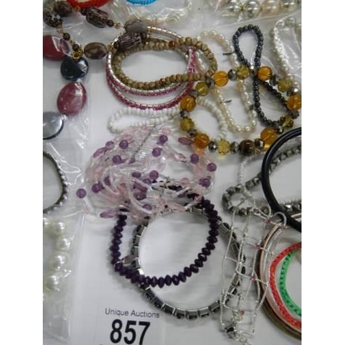 857 - A good lot of bracelets etc.,