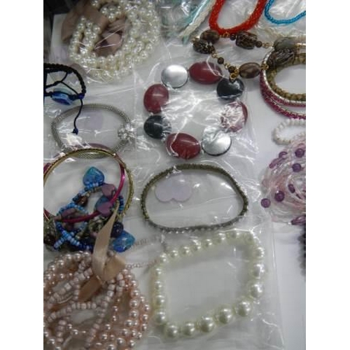 857 - A good lot of bracelets etc.,