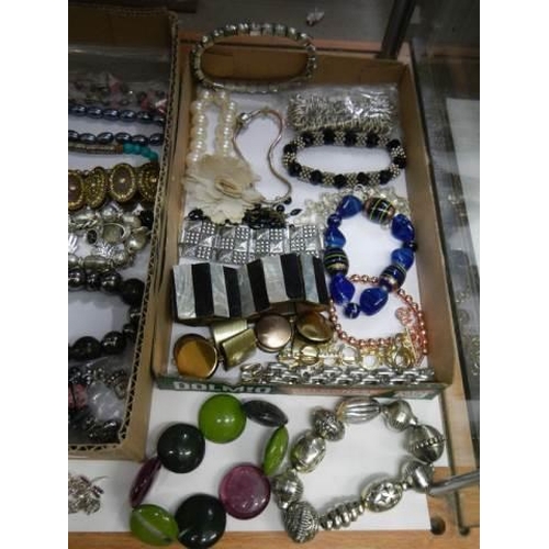 875 - Approximately twenty five necklaces and bracelets.