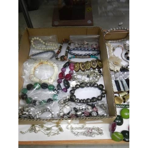 875 - Approximately twenty five necklaces and bracelets.