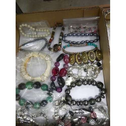 875 - Approximately twenty five necklaces and bracelets.