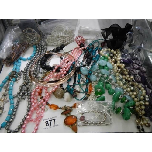 877 - Approximately twenty necklaces.