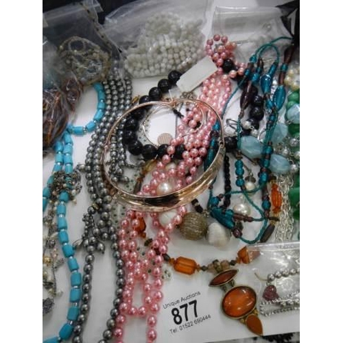 877 - Approximately twenty necklaces.