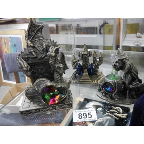 895 - Three pewter gemstone figures.