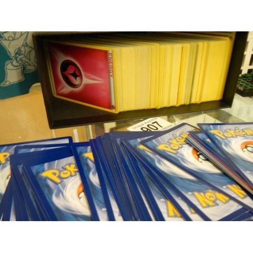 907 - A quantity of Pokemon cards in steam seige box.