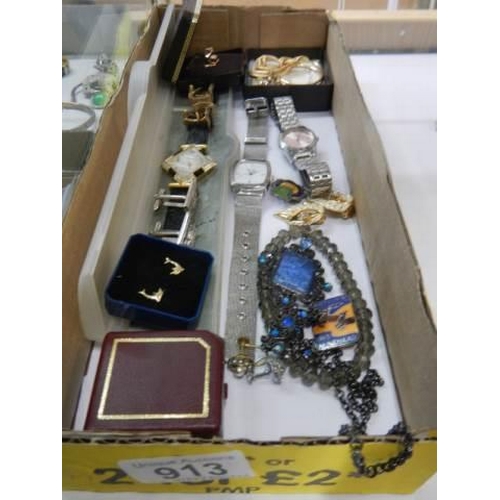 913 - A mixed lot of watches, cuff links etc.,