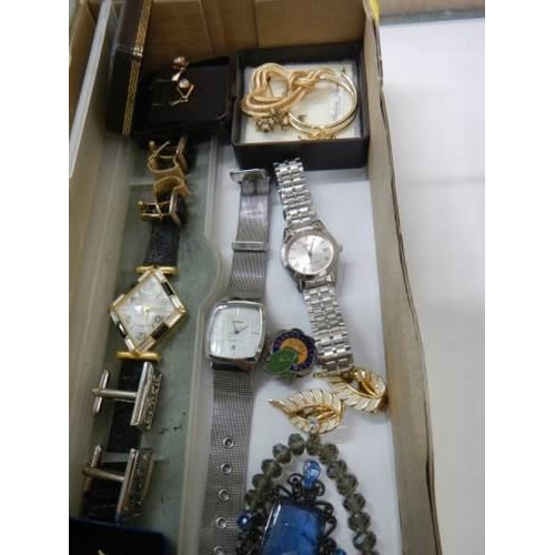 913 - A mixed lot of watches, cuff links etc.,