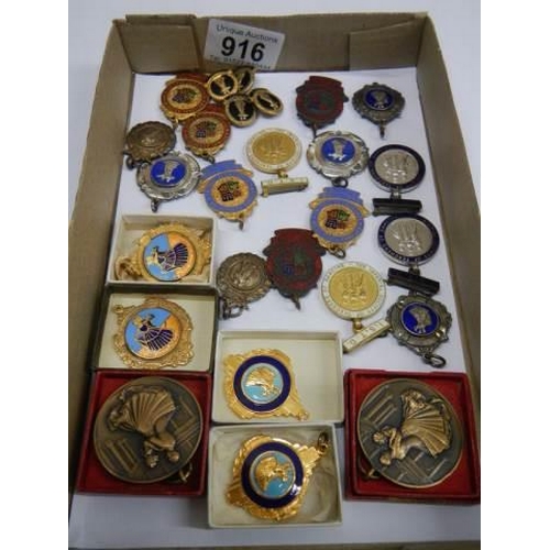 916 - A good mixed lot of badges and medallions.