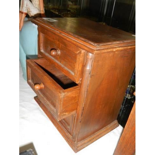 943 - A small mahogany three drawer chest. COLLECT ONLY.