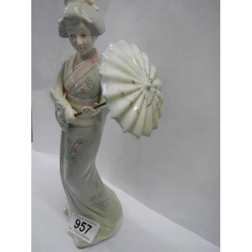 957 - A porcelain figure of a Geisha from the Hidamel collection.