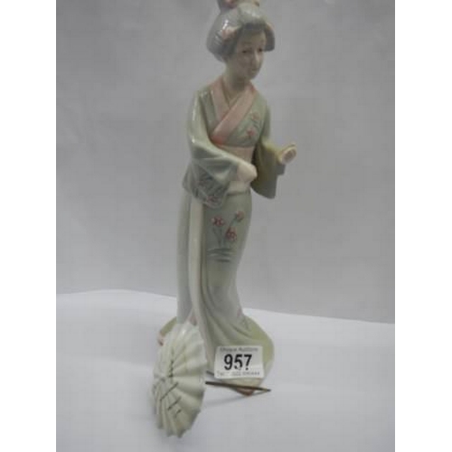 957 - A porcelain figure of a Geisha from the Hidamel collection.