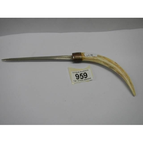 959 - A boar tusk letter opener.