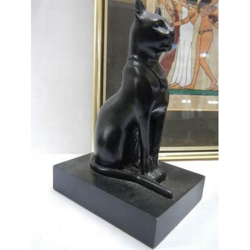 963 - An Egyptian picture and two Egyptian God Bastet items.