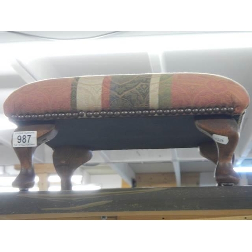 987 - A good footstool on Queen Anne style legs, in good condition.