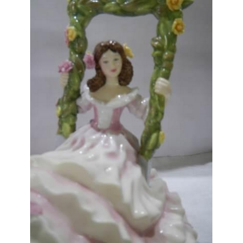 996 - A Royal Doulton Blossom Time figurine and a Coalport Victoria Rose figurine