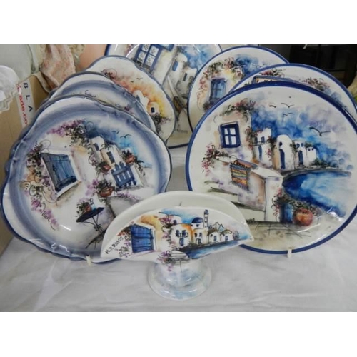 999 - A collection of handpainted and signed Greek town scene plates.