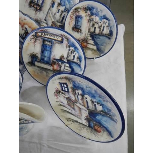 999 - A collection of handpainted and signed Greek town scene plates.