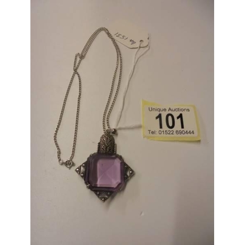 101 - A silver pendant set large amethyst coloured stone.