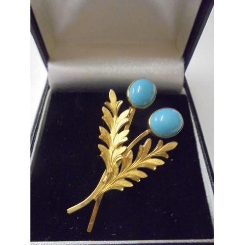 102 - A superb quality yellow metal brooch set turquoise coloured stones stamped 12k.