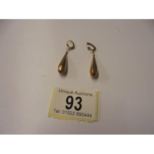 93 - A pair of gold pendant earrings, 3.3 grams.
