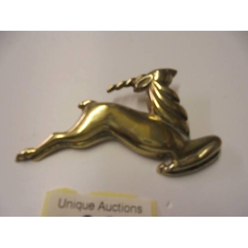 98 - A silver gilt antelope brooch marked Monet, Sterling.