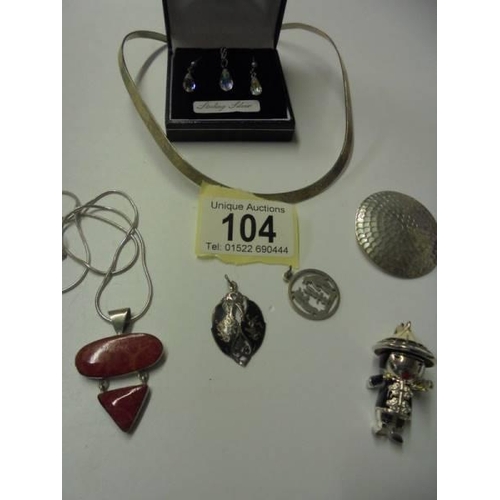 104 - A silver pendant with matching earrings, 4 silver pendants, a silver choker and a Chinese figure pen... 