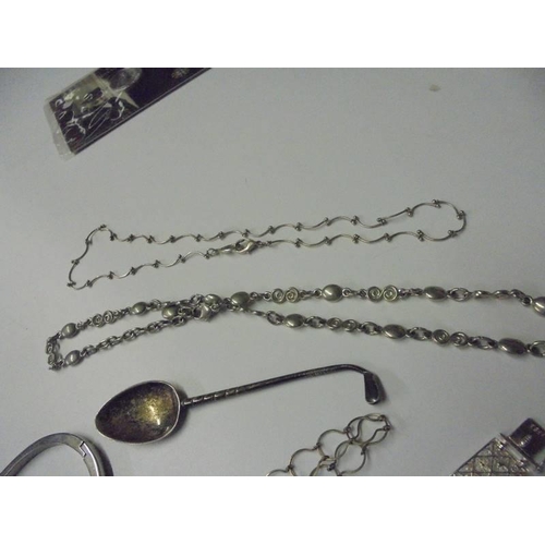 112 - A mixed lot of necklaces, bracelets, silver spoon, pill box etc.