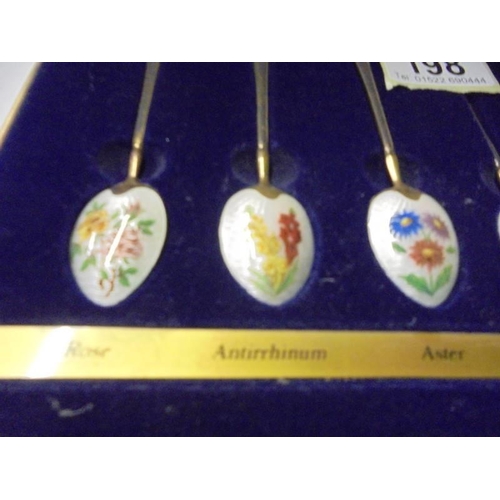 198 - A cased set of The Birmingham Mint  gold plate on silver floral enamel spoons.