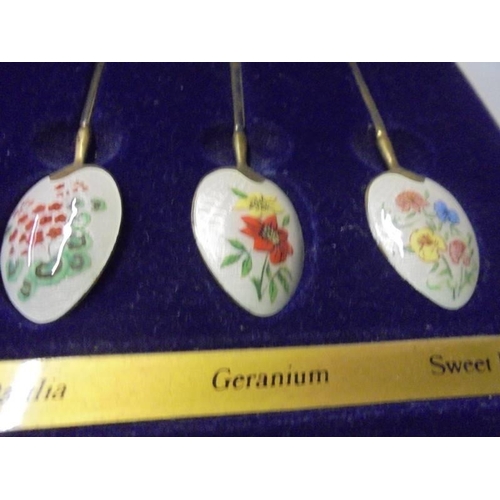 198 - A cased set of The Birmingham Mint  gold plate on silver floral enamel spoons.