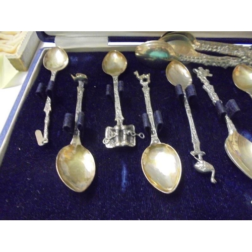 199 - A cased set of 12 decorative tea spoons and six other.