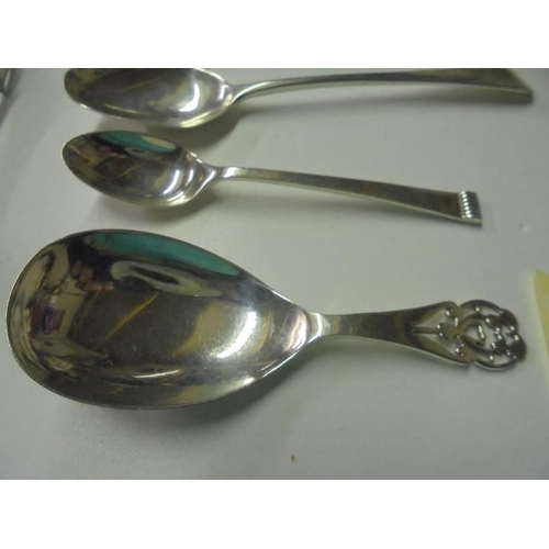 237 - A silver caddy spoon, 3 silver spoons, silver sugar nips, silver book mark, silver penknife etc.,