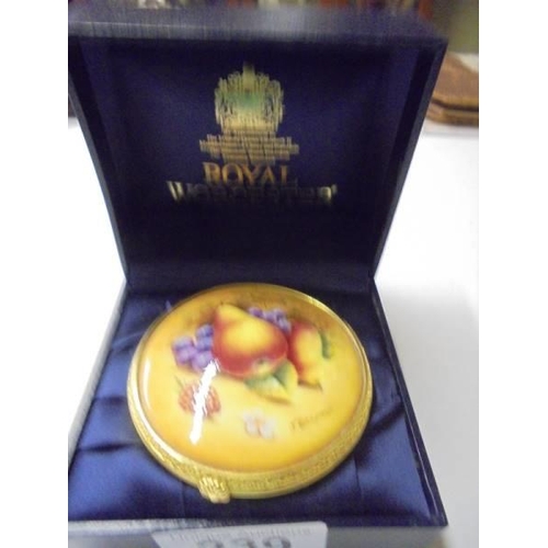 239 - A boxed Royal Worcester porcelain trinket box.