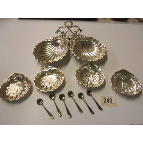 240 - A quantity of silver plate 'Scallop' dishes and six salt spoons.