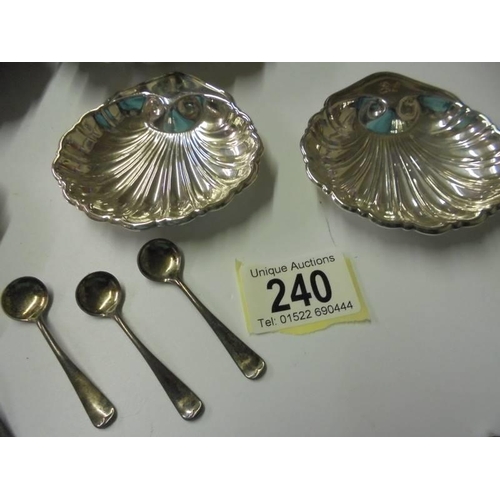 240 - A quantity of silver plate 'Scallop' dishes and six salt spoons.