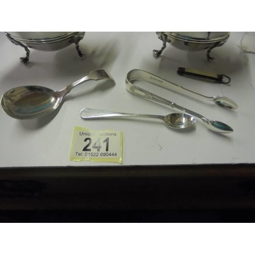 241 - A pair of silver plate sauce boats, spoons, sugar nips etc.,