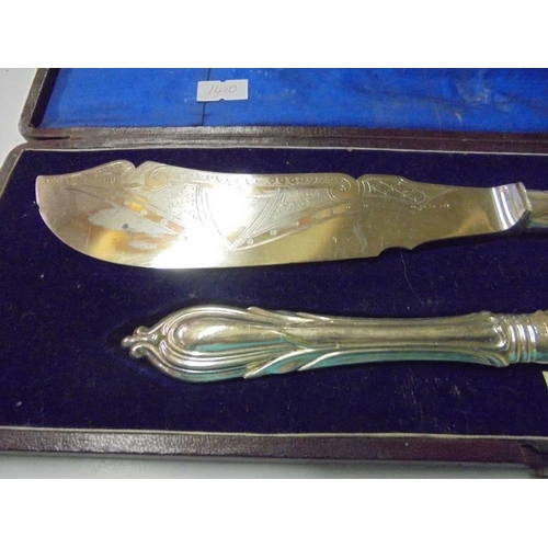 242 - A cased pair of silver plate fish servers.