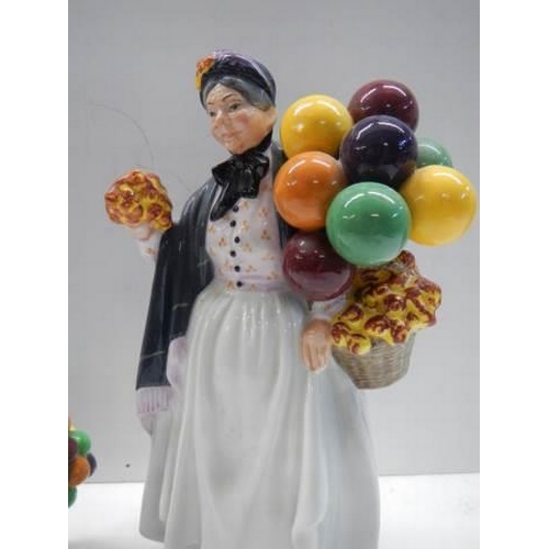 287 - Two Royal Doulton figurinesm - The Old Balloon Seller HN2129 and Biddy Penny Farthing HN1843.